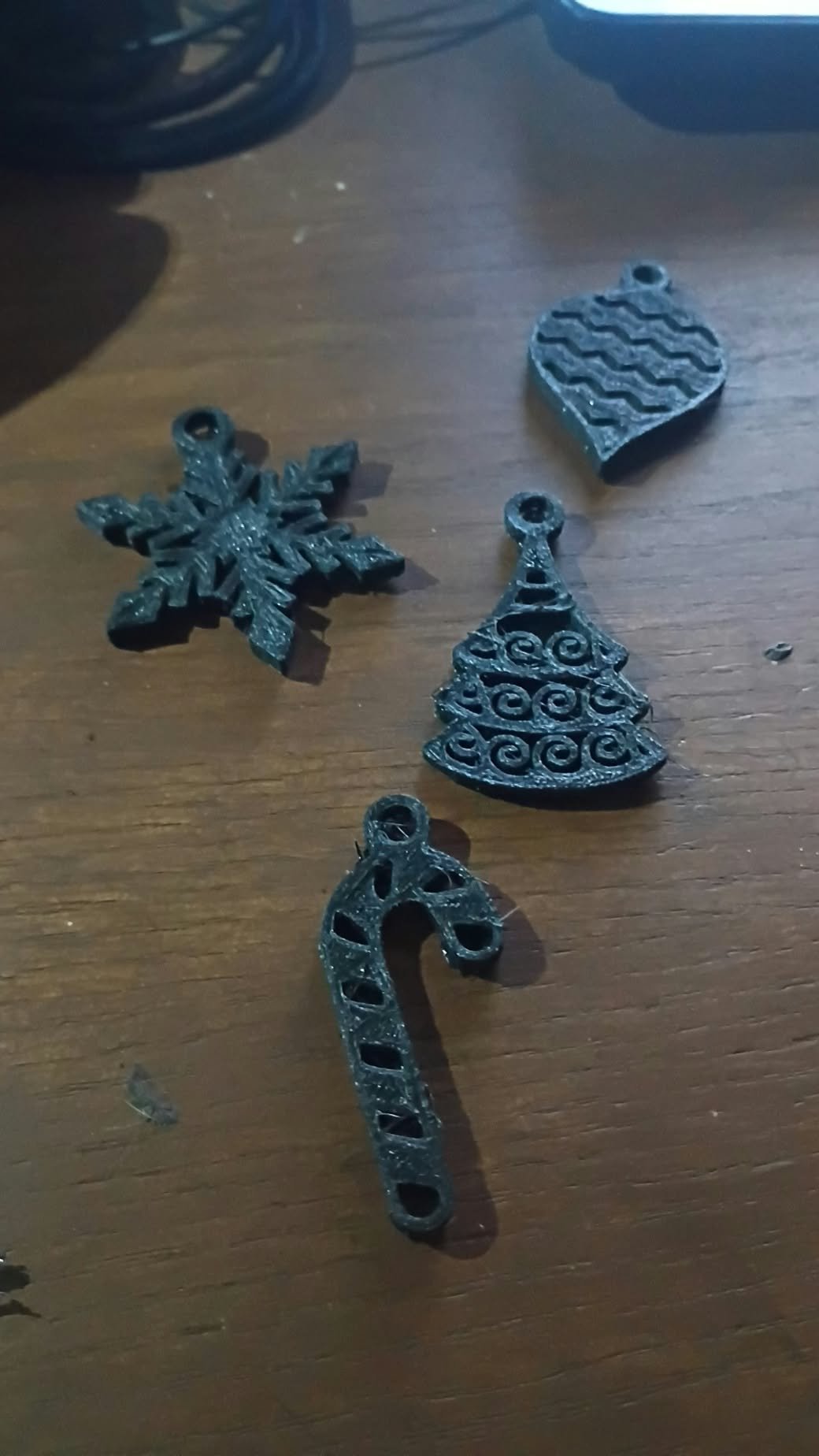 Set of four 3D printed Christmas ornaments: snowflake, tree, candy cane and bauble