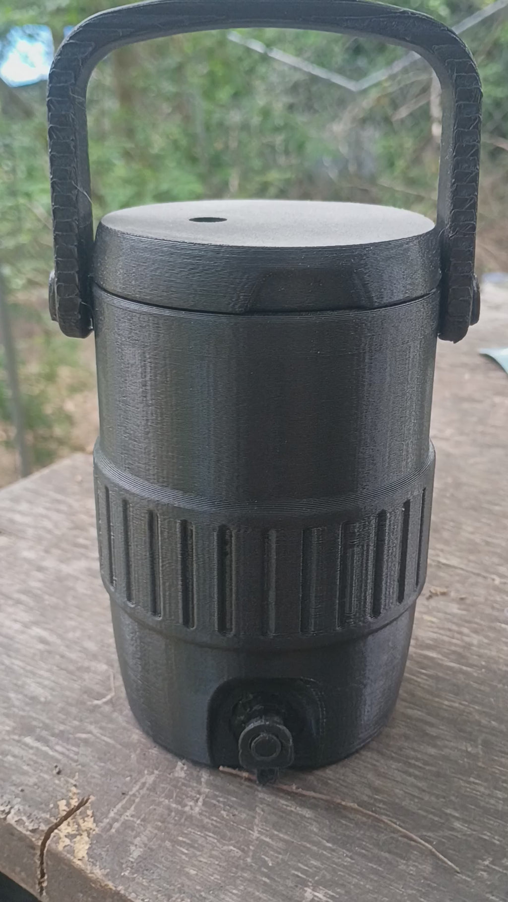 A 3d printed can holder with lid keeps your drinks from getting knocked over.
