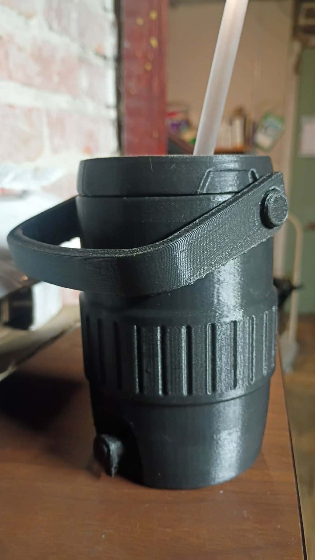 A 3d printed can holder with lid keeps your drinks from getting knocked over.