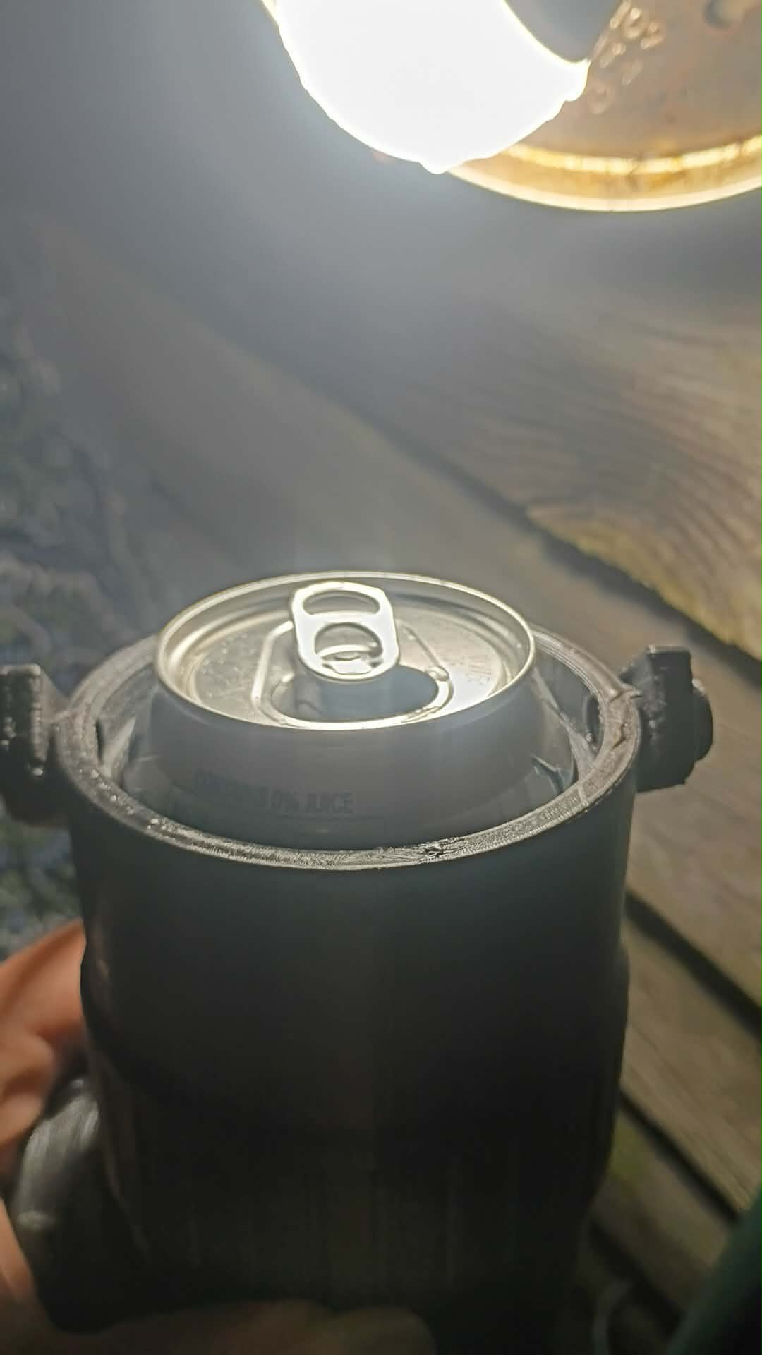 A 3d printed can holder with lid keeps your drinks from getting knocked over.